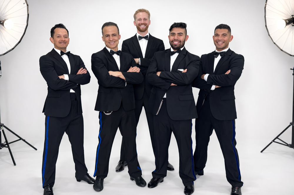 Latin Dance Utah team members dressed formally in tuxedos.